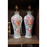 A pair of Chinese famille rose vase form table lamps, 19th century, of inverted baluster form,