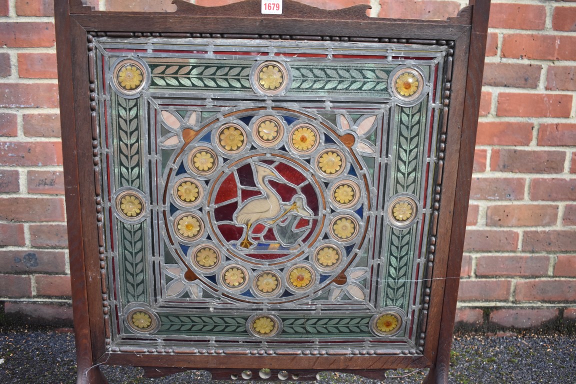A Victorian stained and leaded glass panel, 54.5 x 56cm, (minor cracks), mounted in a 1920s oak - Image 2 of 3