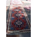 WITHDRAWN FROM SALE A Persian rug, having four central medallions, with floral and geometric.