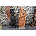 An African carved hardwood bust of lady and three other similar carved African items, largest 136cm.