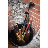A quantity of vintage sporting equipment, to include: tennis rackets; cricket bats and golf clubs.