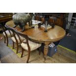 A late Victorian walnut extending dining table, 240cm extended, with winder.