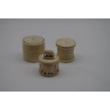 Three old ivory circular boxes and covers, largest 6cm diameter.