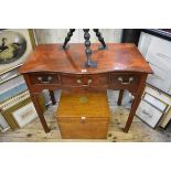 A George III mahogany serpentine fronted side table, with three frieze drawers on square moulded