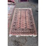 A modern Bokhara style rug, having repeated decoration to central field; together with one other