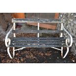 An old teak garden bench having steel supports, 122cm wide. This lot can only be collected on