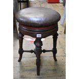 A late Victorian carved mahogany adjustable piano stool.