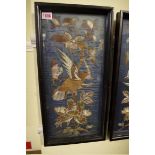 A pair of Chinese embroidered silk panels,18th/19th century, decorated with birds in flowering