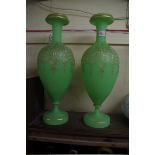 A large pair of antique uranium glass pedestal vases, with gilt decoration, 52cm high.