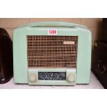 A vintage Ekco green plastic radio, Type U122 receiver.