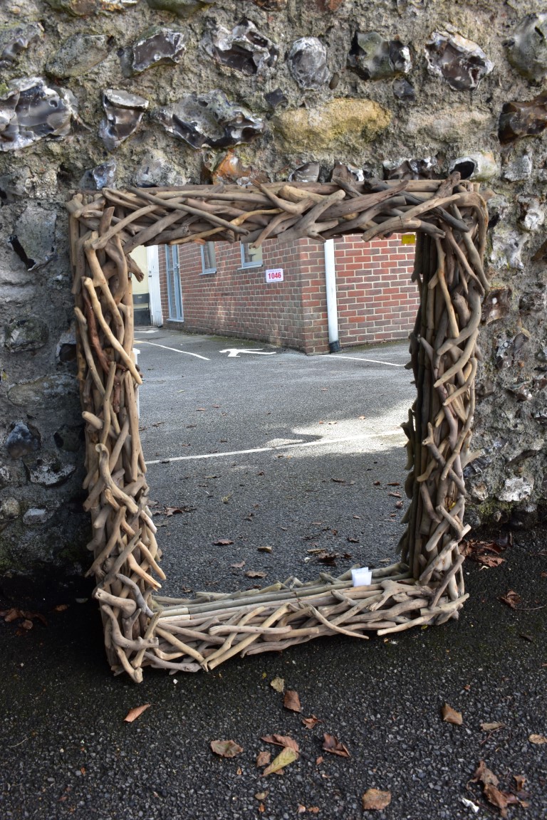 A modern rectangular wall mirror, having driftwood frame, 93 x 76cm. This lot can only be