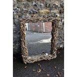 A modern rectangular wall mirror, having driftwood frame, 93 x 76cm. This lot can only be