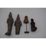 Antiquities: four Egyptian carved stone items, to include shabtis, largest 26cm high. (s.d.).