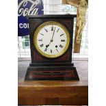 A late 19th century Egyptian Revival slate and porphyry mantel clock, 37cm high, with pendulum.