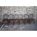 A set of six dark Ercol stick back dining chairs. This lot can only be collected on Saturday 5th