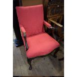 An 18th century carved walnut and red damask Gainsborough chair, (restorations).