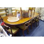 A mahogany extending dining table, with four associated leaves, 332cm extended.