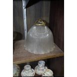 A Holophane glass light shade, with original brass gallery, 19cm diameter.