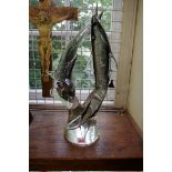 A large 1970s Murano smoky glass figure group of dolphins, by Livio Seguso, signed, 53cm high.