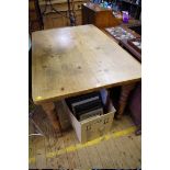 A Victorian pine kitchen table, on turned legs, 135cm long.