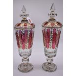 A large pair of antique Bohemian clear and cranberry flashed vases and covers, with gilt decoration,