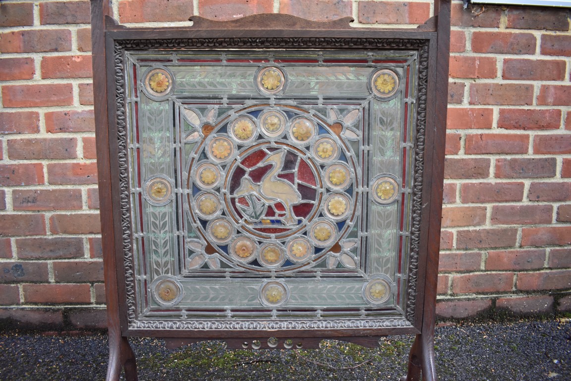 A Victorian stained and leaded glass panel, 54.5 x 56cm, (minor cracks), mounted in a 1920s oak - Image 3 of 3