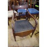 An unusual Regency mahogany elbow commode chair.