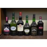 A mixed lot of alcohol, comprising: two 70cl bottles of sloe gin; and four 1 litre bottles of