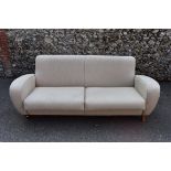 A modern cream upholstered two seater sofa, 205cm wide. This lot can only be collected on Saturday