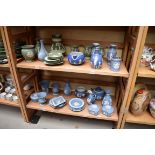 A collection of Wedgwood and other jasperware. (two shelves)