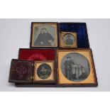 A collection of four daguerreotypes.