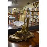 An unusual antique gilt metal figural table lamp, 48cm wide.