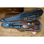 An antique Continental violin, indistinctly labelled to interior, with 14in one piece back, (crack
