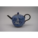 A Chinese blue and white wine pot and cover, Kangxi, painted with figures and scrolling foliage,