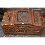 An Oriental carved wooden trunk.This lot can only be collected on Saturday 10th October (10-2pm)