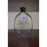 An unusually large 19th century clear glass flask, engraved with a crest, with electroplated lid,