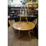 A vintage Ercol 'Blonde' elm drop leaf dining table, 124cm extended; together with a set of four