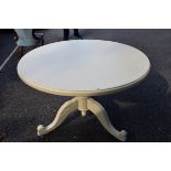 A circular painted pine dining table, 120cm wide. This lot can only be collected on Saturday 10th