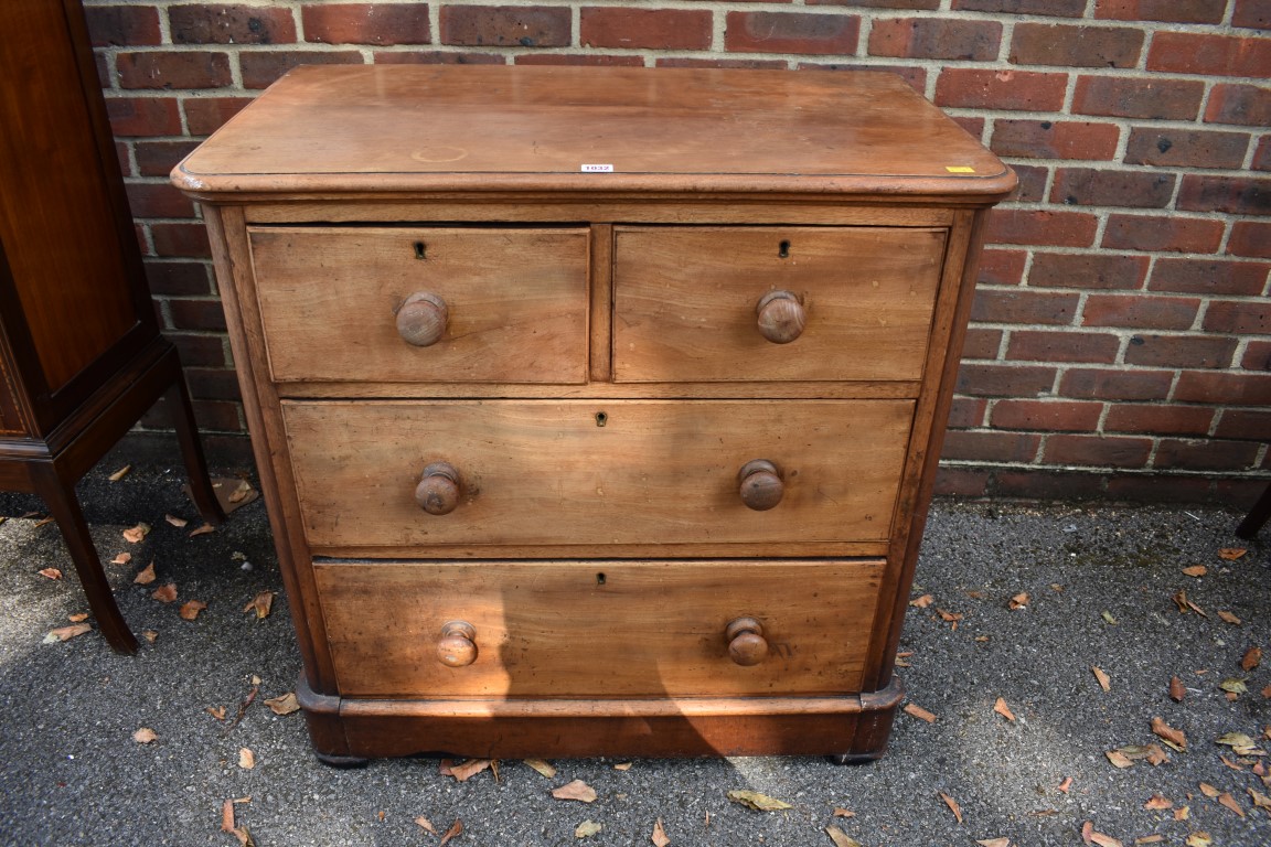 An antique mahogany chest of two short and two long drawers, 88cm wide. This lot can only be