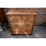 An antique mahogany chest of two short and two long drawers, 88cm wide. This lot can only be