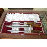 A boxed antler handled three piece carving set.