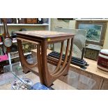 A vintage nest of three rosewood tables, the largest with tile inset top, 50cm wide.