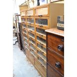 A vintage haberdashery chest, 157cm high x 141cm wide, lacking top surface.