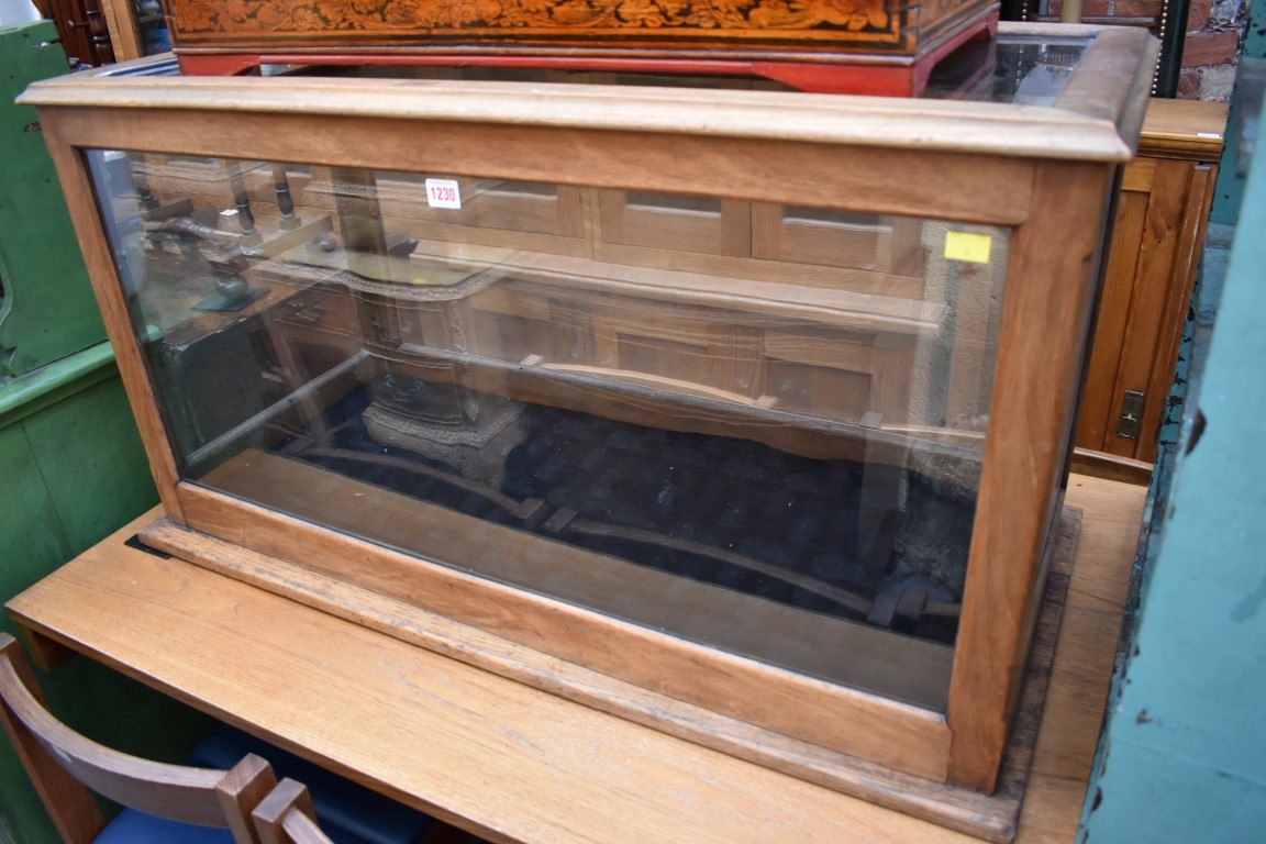 An early 20th century mahogany museum display case, with glazed top, 56cm high x 145cm wide x 49.5cm