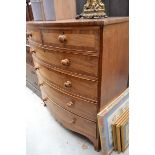 A large 19th century mahogany and cross banded bowfront chest of drawers, 116cm wide.