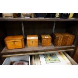 A group of four tea caddies, to include two George III satinwood examples, largest 19cm wide; and