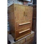 A 1920s oak bedside cupboard, by Heal's, 56cm wide.