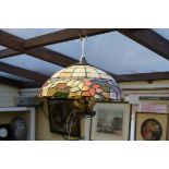 A pair of Tiffany style leaded and coloured glass ceiling lights, 40cm diameter.