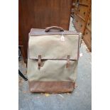 A vintage French folding artist's easel, initialled SDGD, in canvas bag; together with a folding