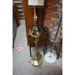 An old brass standard lamp.